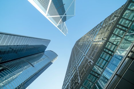 Buildings under a blue and white sky